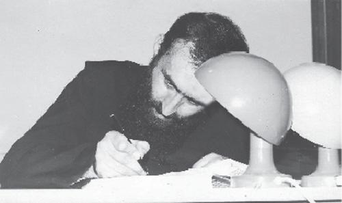 În chilia sa, la masa de scris